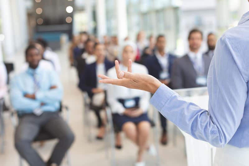 Professional speaker presenting a keynote to a corporate office